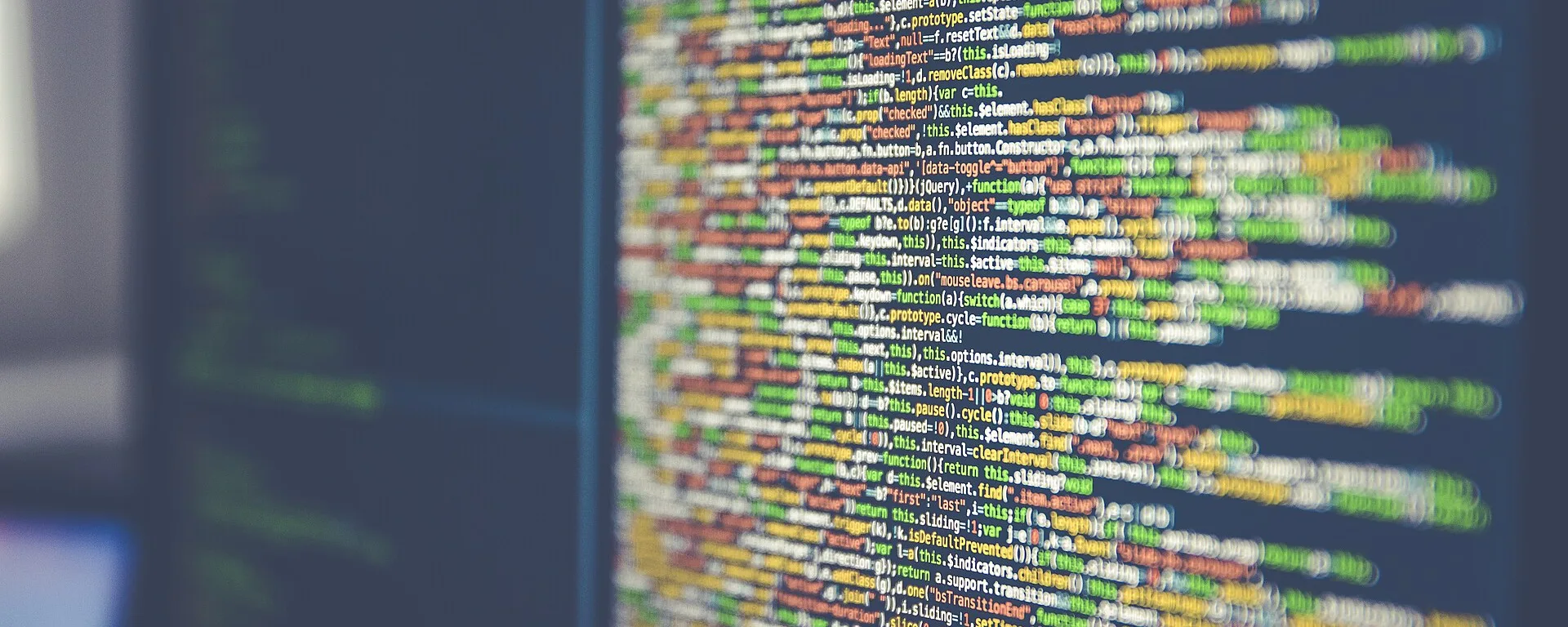 Blurred lines of code on a computer monitor